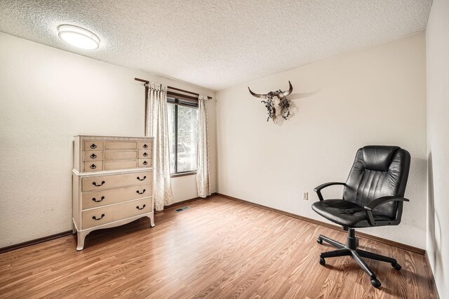 2617 35th Ave SE, Puyallup, WA 98374 - office featuring light wood-style floors, a textured ceiling, and baseboards