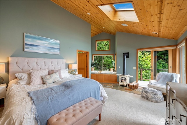 2778 N Nugent Rd N, Lummi Island, WA 98262 - bedroom featuring a wood stove, a skylight, wood ceiling, access to exterior, and high vaulted ceiling
