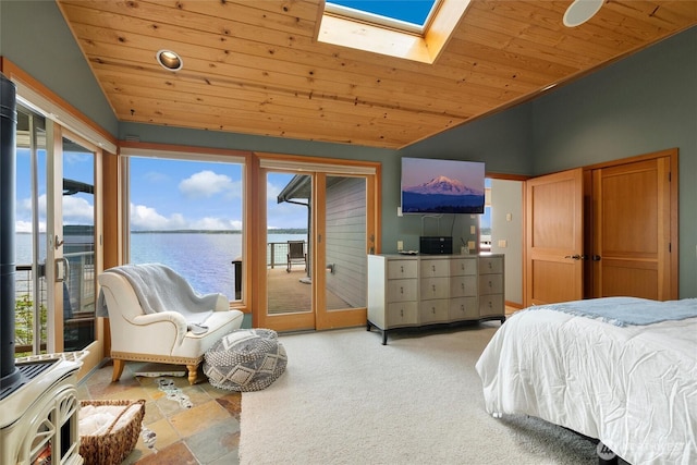 2778 N Nugent Rd N, Lummi Island, WA 98262 - bedroom with lofted ceiling, wood ceiling, access to outside, multiple windows, and a skylight