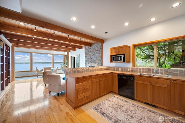 2778 N Nugent Rd N, Lummi Island, WA 98262 - kitchen featuring dishwasher, a sink, stainless steel microwave, plenty of natural light, and beam ceiling