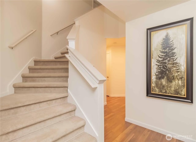 5610 Norpoint Way NE, Tacoma, WA 98422 - staircase featuring wood finished floors and baseboards