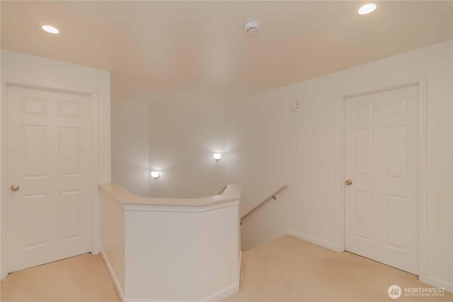 5610 Norpoint Way NE, Tacoma, WA 98422 - hall featuring recessed lighting, light carpet, and an upstairs landing