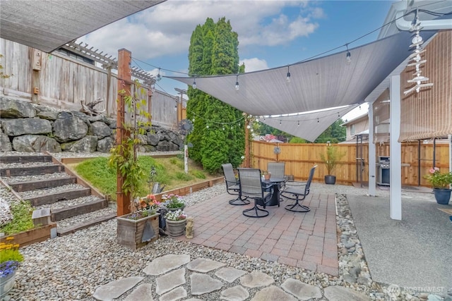 5610 Norpoint Way NE, Tacoma, WA 98422 - fenced backyard with a patio area, outdoor dining area, and area for grilling