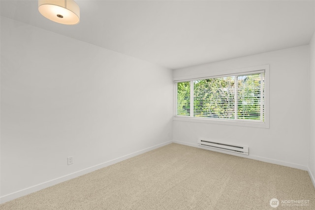 19414 Aurora Ave N Unit 204, Shoreline, WA 98133 - spare room featuring a baseboard radiator, carpet floors, and baseboards