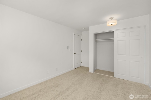 19414 Aurora Ave N Unit 204, Shoreline, WA 98133 - unfurnished bedroom with carpet, baseboards, and a closet