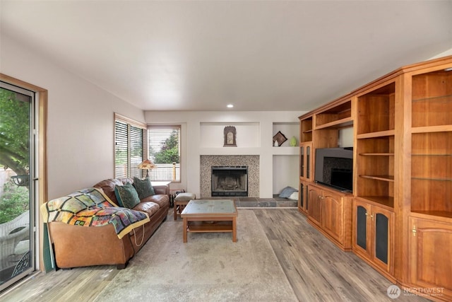 707 S 32nd, Renton, WA 98055 - living room with a tiled fireplace and wood finished floors