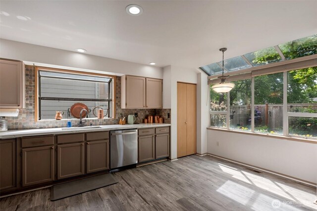 707 S 32nd, Renton, WA 98055 - kitchen featuring stainless steel dishwasher, a sink, backsplash, light wood finished floors, and recessed lighting