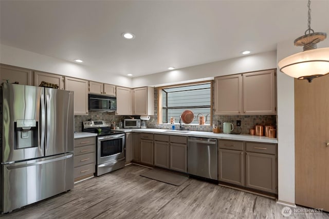 707 S 32nd, Renton, WA 98055 - kitchen with stainless steel appliances, gray cabinets, backsplash, light countertops, and recessed lighting