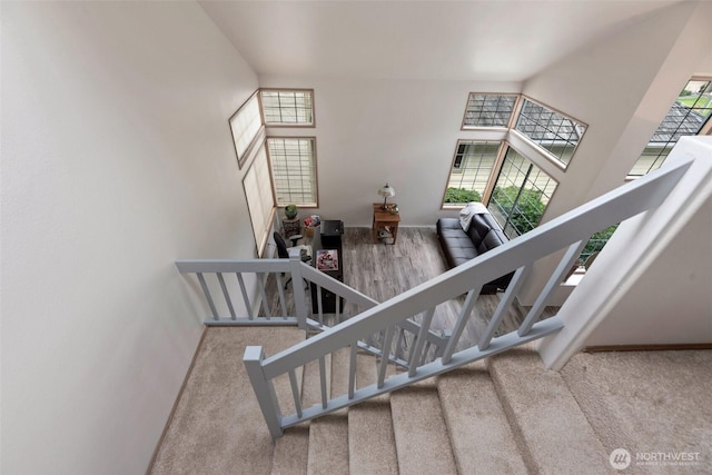 707 S 32nd, Renton, WA 98055 - staircase with carpet flooring, baseboards, and a high ceiling
