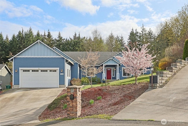 1172 Matterhorn Loop, Camano Island, WA 98282 - single story home with board and batten siding, concrete driveway, and an attached garage