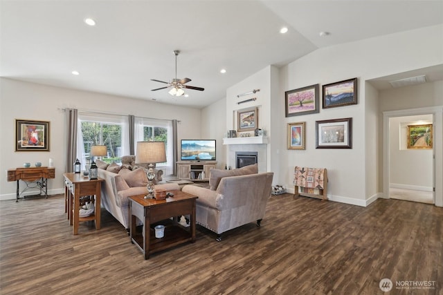 1172 Matterhorn Loop, Camano Island, WA 98282 - living area with ceiling fan, dark wood-style floors, lofted ceiling, baseboards, and a tiled fireplace