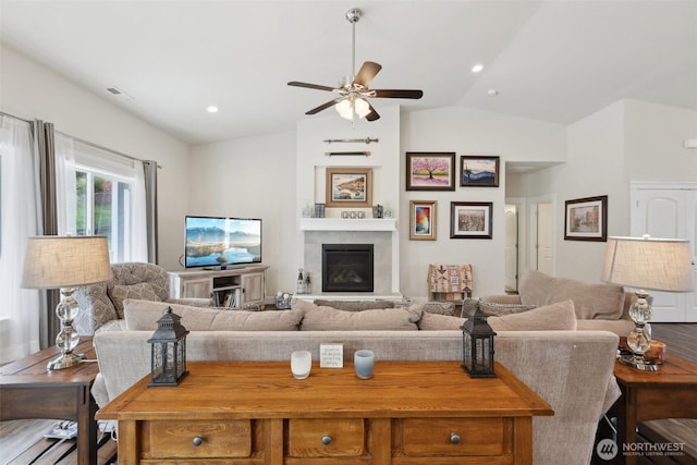 1172 Matterhorn Loop, Camano Island, WA 98282 - living area with a ceiling fan, lofted ceiling, and a large fireplace