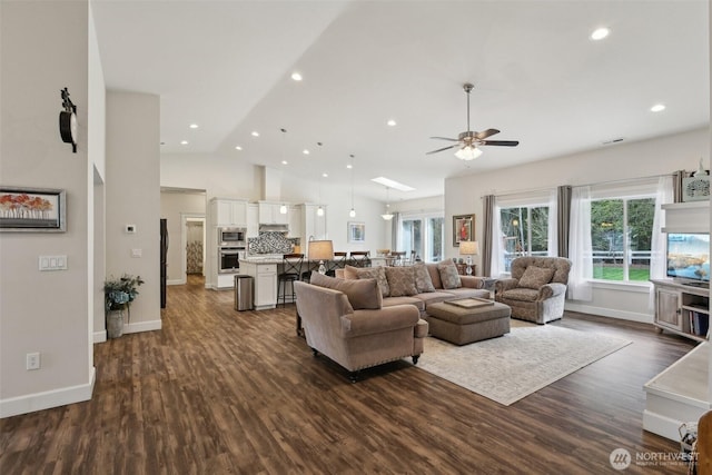1172 Matterhorn Loop, Camano Island, WA 98282 - living room with ceiling fan, dark wood-type flooring, lofted ceiling, baseboards, and recessed lighting