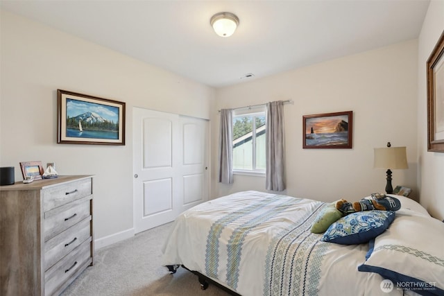 1172 Matterhorn Loop, Camano Island, WA 98282 - bedroom featuring light carpet, a closet, and baseboards