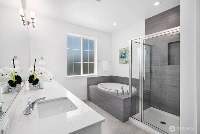 14144 270th Ln NE, Duvall, WA 98019 - bathroom featuring double vanity, a garden tub, a stall shower, tile patterned flooring, and recessed lighting