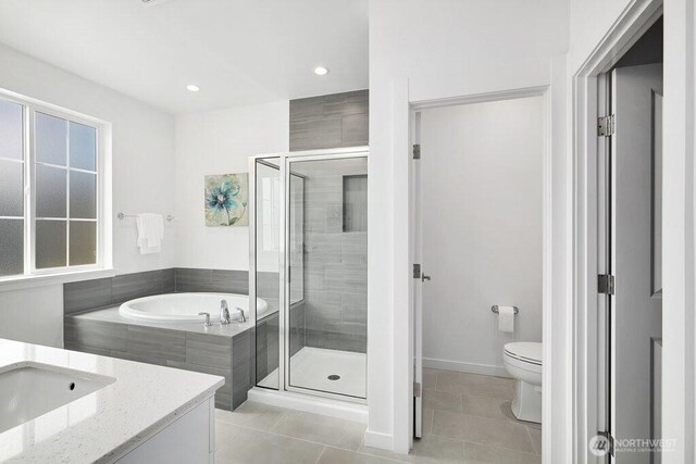 14144 270th Ln NE, Duvall, WA 98019 - full bathroom with tile patterned flooring, a shower stall, a bath, vanity, and recessed lighting