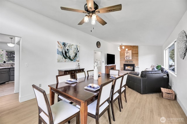 1302 Park Ave, Snohomish, WA 98290 - dining space featuring healthy amount of natural light, a multi sided fireplace, light wood-style floors, and a ceiling fan