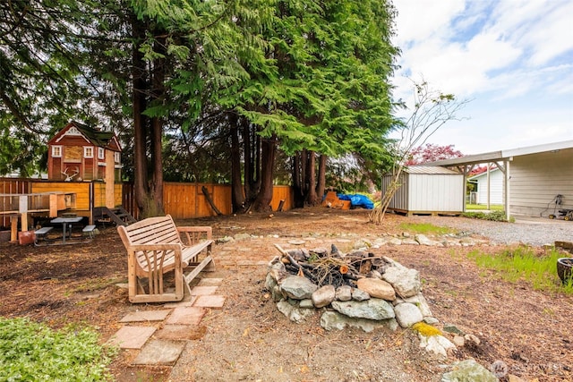 1302 Park Ave, Snohomish, WA 98290 - view of yard featuring an outdoor fire pit and a storage unit