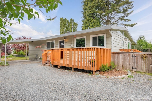 1302 Park Ave, Snohomish, WA 98290 - ranch-style house with a wooden deck and an attached carport