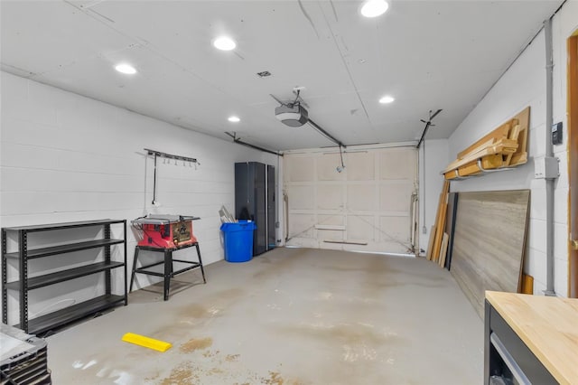 7715 236th St SW, Edmonds, WA 98026 - garage featuring a garage door opener and recessed lighting