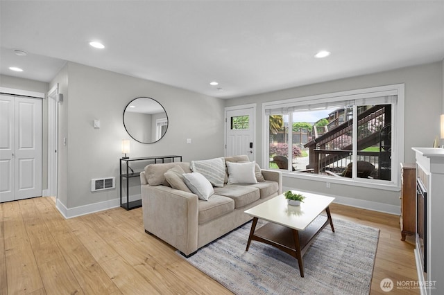 21301 48th Ave W Unit A104, Mountlake Terrace, WA 98043 - living area with light wood-style floors, baseboards, and recessed lighting