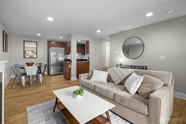 21301 48th Ave W Unit A104, Mountlake Terrace, WA 98043 - living area featuring light wood-type flooring, recessed lighting, and baseboards
