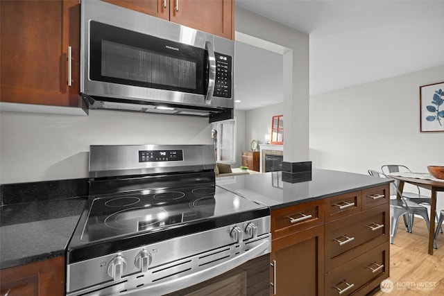 21301 48th Ave W Unit A104, Mountlake Terrace, WA 98043 - kitchen with appliances with stainless steel finishes and light wood-style flooring