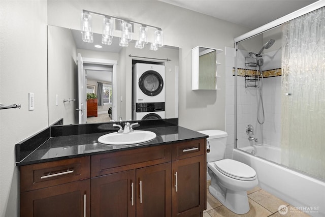 21301 48th Ave W Unit A104, Mountlake Terrace, WA 98043 - full bath featuring stacked washer and clothes dryer, shower / bathtub combination, tile patterned floors, toilet, and vanity