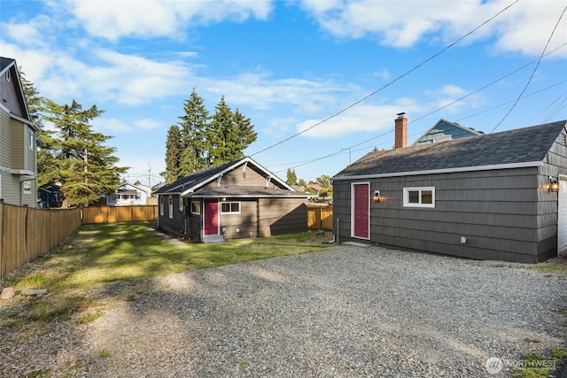 3514 S Tyler St, Tacoma, WA 98409 - back of property featuring an outbuilding and a shingled roof
