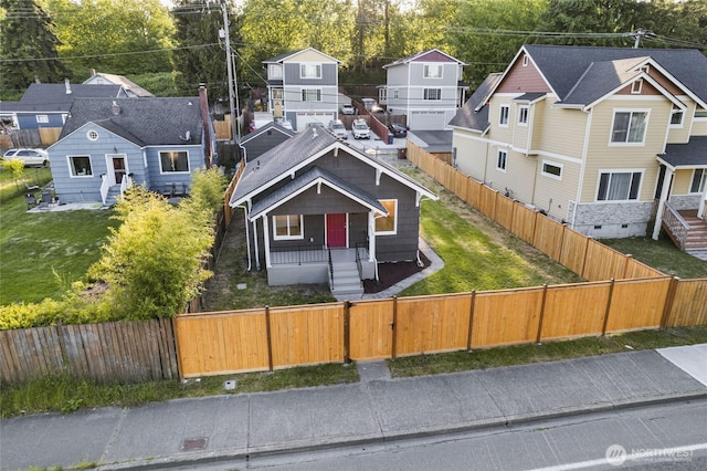 3514 S Tyler St, Tacoma, WA 98409 - view of front of house with a fenced front yard, covered porch, and a residential view