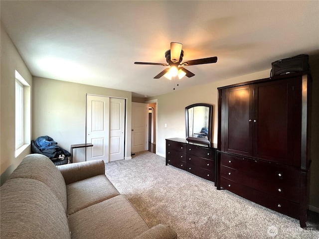 6612 E B St, Tacoma, WA 98404 - living area featuring light colored carpet, a ceiling fan, and baseboards