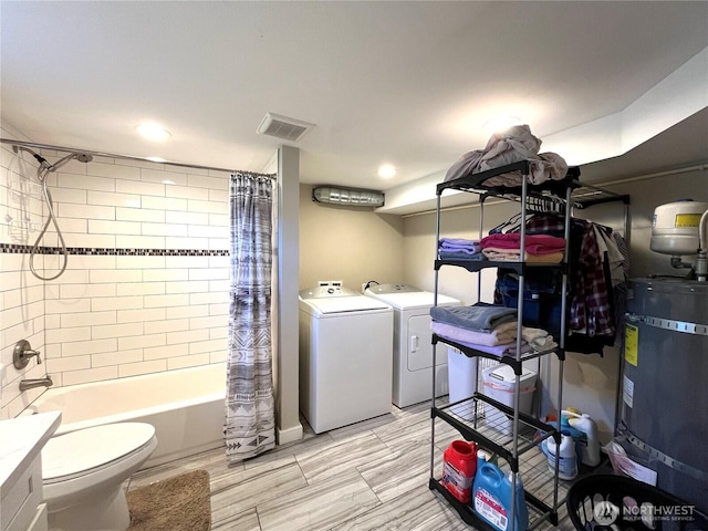 6612 E B St, Tacoma, WA 98404 - washroom with washer and dryer, water heater, and recessed lighting