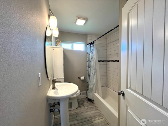 6612 E B St, Tacoma, WA 98404 - bathroom featuring shower / bath combination with curtain, baseboards, toilet, and a textured wall