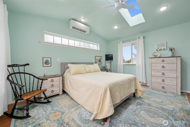 177 N Razor Clam Dr SW, Ocean Shores, WA 98569 - bedroom featuring a wall unit AC, a skylight, vaulted ceiling, recessed lighting, and a ceiling fan