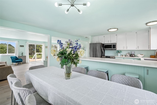 177 N Razor Clam Dr SW, Ocean Shores, WA 98569 - dining area featuring light wood-style flooring