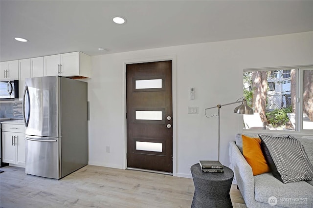 275 Maple St, Camano Island, WA 98282 - foyer entrance featuring light wood-style floors, recessed lighting, and baseboards