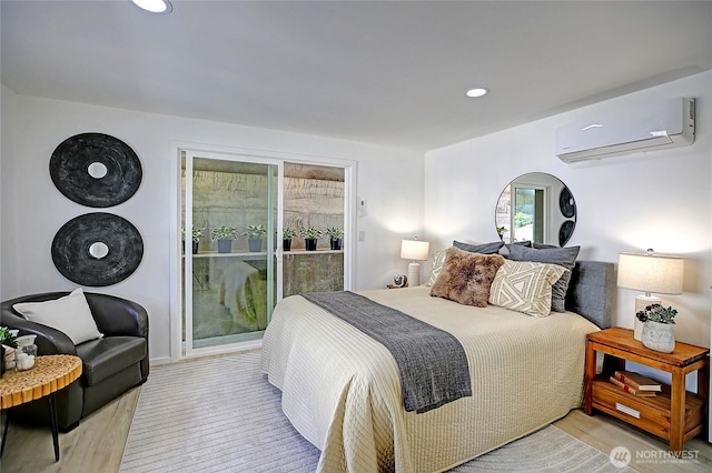 275 Maple St, Camano Island, WA 98282 - bedroom featuring a wall unit AC, wood finished floors, and recessed lighting
