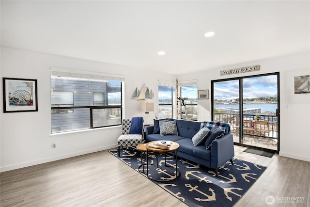 817 Kitsap St, Port Orchard, WA 98366 - living room featuring wood finished floors, baseboards, a water view, and recessed lighting