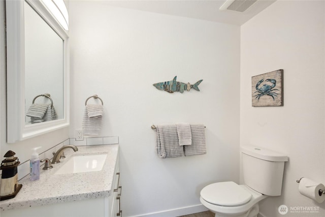 817 Kitsap St, Port Orchard, WA 98366 - bathroom featuring toilet, vanity, and baseboards