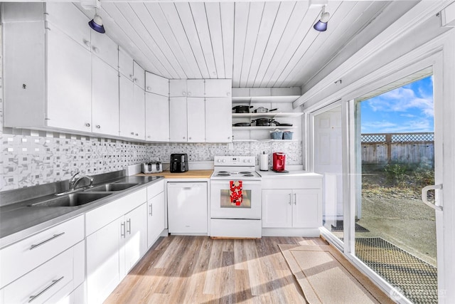 7491 Birch Bay Dr, Blaine, WA 98230 - kitchen with white appliances, a sink, open shelves, light wood-style floors, and white cabinets