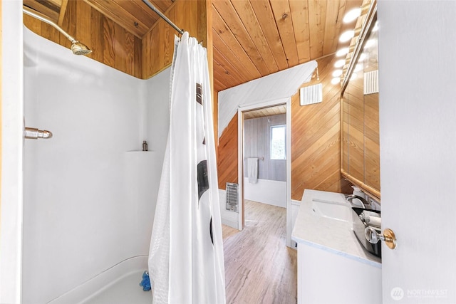 7491 Birch Bay Dr, Blaine, WA 98230 - bathroom featuring vanity, a shower with curtain, wood walls, wooden ceiling, and wood finished floors