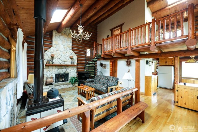 54 Center View Dr, Decatur Island, WA 98221 - living room featuring wood finished floors, log walls, wood ceiling with exposed beams, high vaulted ceiling, and a chandelier