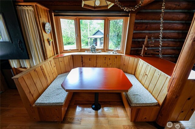 54 Center View Dr, Decatur Island, WA 98221 - dining room with breakfast area, log walls, and light wood finished floors