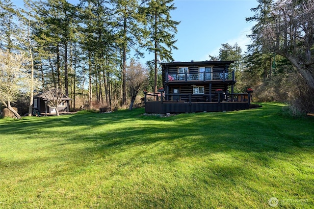 54 Center View Dr, Decatur Island, WA 98221 - view of green lawn with a wooden deck, a balcony, and an outdoor structure