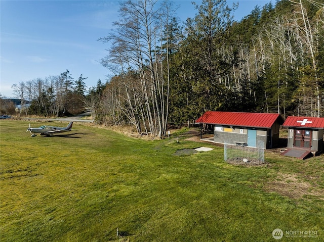54 Center View Dr, Decatur Island, WA 98221 - view of green lawn with an outdoor structure