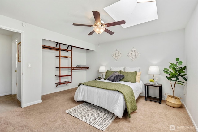 7475 Trica Ave, Bremerton, WA 98311 - bedroom with carpet floors, a skylight, baseboards, and ceiling fan