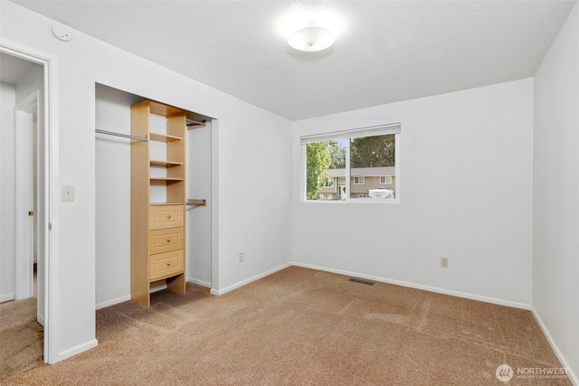 7475 Trica Ave, Bremerton, WA 98311 - unfurnished bedroom featuring light carpet, baseboards, and a closet