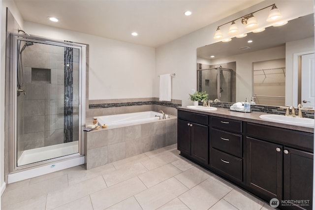 14204 67th Avenue Ct E, Puyallup, WA 98373 - bathroom featuring a stall shower, a garden tub, double vanity, tile patterned floors, and recessed lighting