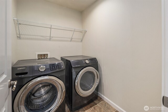 14204 67th Avenue Ct E, Puyallup, WA 98373 - laundry area with washer and clothes dryer and baseboards