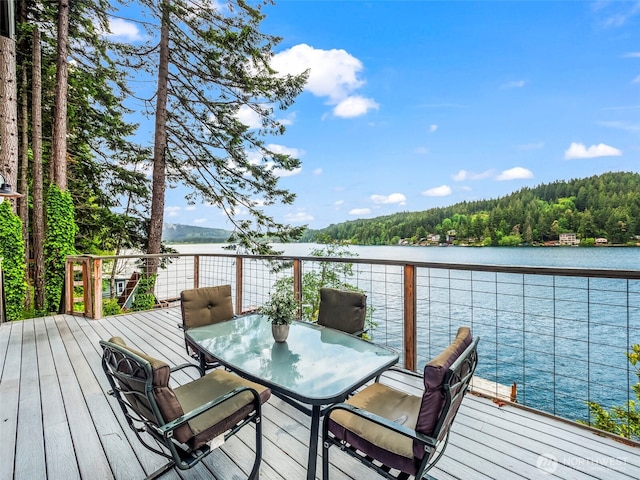 1201 Summit Lake Shore Rd NW, East Olympia, WA 98502 - wooden terrace featuring a water view, outdoor dining area, and a wooded view